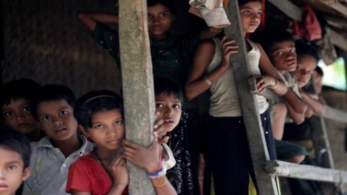 Rohingya Muslim children stand in U Shey Kya village outside Maungdaw in Rakhine state