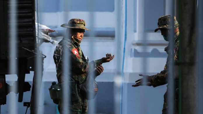 Myanmar soldiers are seen inside City Hall in Yangon, Myanmar